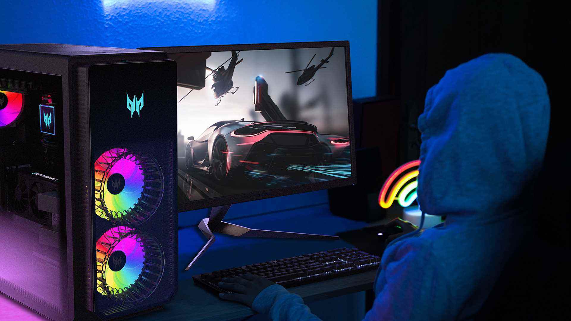 Bir masada monitörün yanında gösterilen Acer Predator Orion 7000 masaüstü oyun bilgisayarı