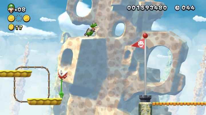 Luigi, New Super Mario Bros'ta hedefe doğru yüzüyor.  U Deluxe.