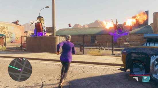 Saints Row rehberi: Oyuncu, fotoğrafını çekmek için iki parlayan heykeli ve turistik bilgiler için birkaç kaidesi olan bir parka doğru koşuyor ve bunların hepsi oyunun %100'ünü tamamlamak için sayılıyor.