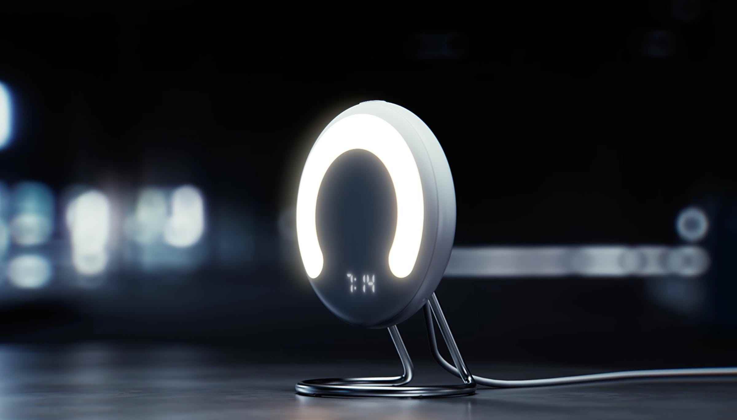 Rise'ın görüntüsü, dörtte üç halkalı LED'li dairesel bir cihaz ve altta küçük bir saat.