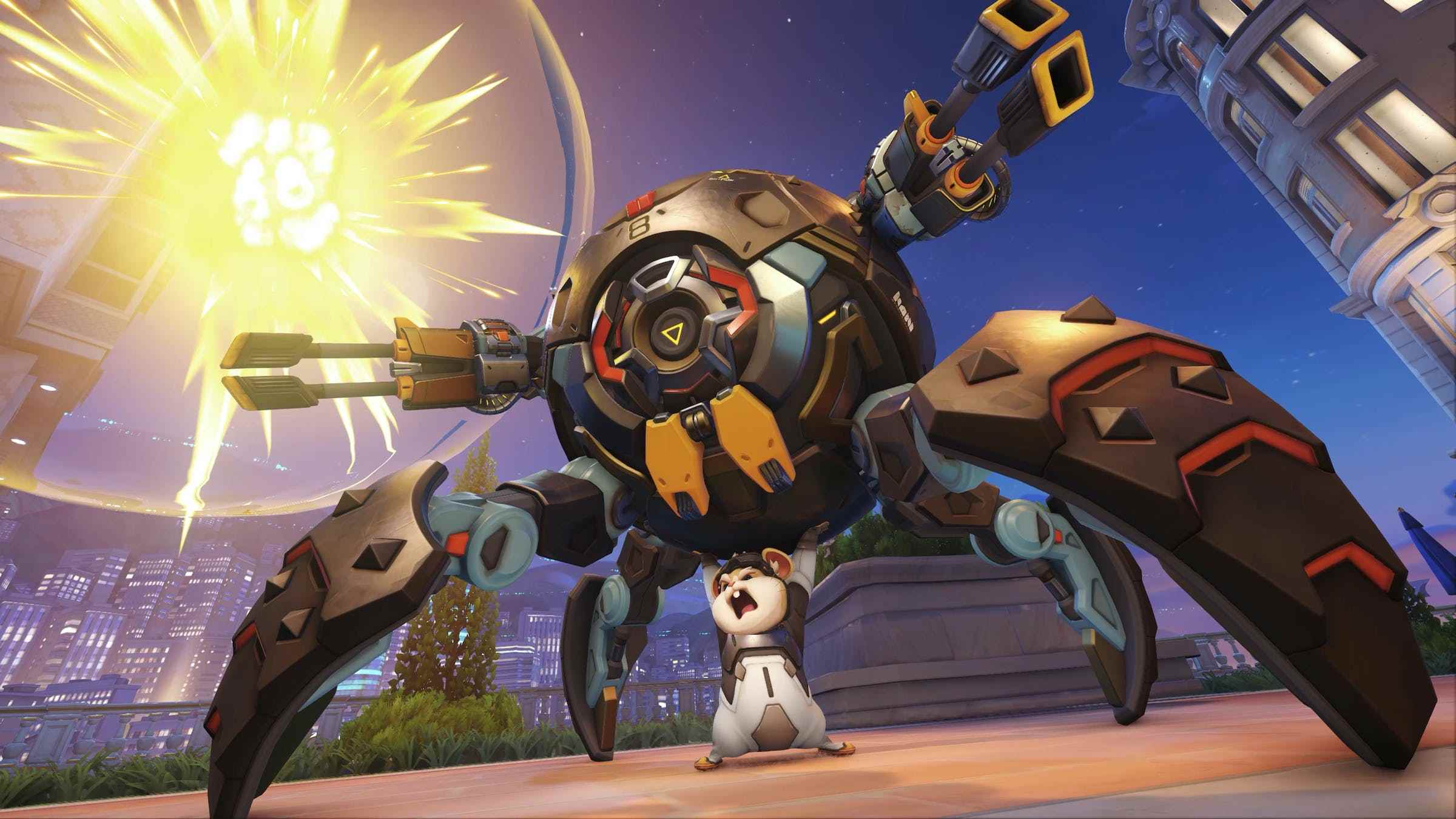 Overwatch 2 kahramanı Wrecking Ball'un ekran görüntüsü, makineli tüfekler ve örümcek benzeri bacaklarla donatılmış mecha hamster topunun altında muzaffer bir şekilde duran küçük bir bronz hamster.