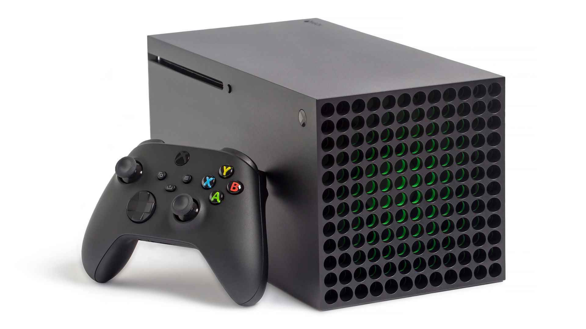 Xbox Series X, üzerinde duran bir oyun kumandası ile yan yatmış durumda