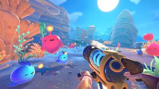 Pokémon gibi en iyi oyunlar - Slime Rancher 2'de Rainbow Island'da birkaç mutlu görünen slime zıplıyor.