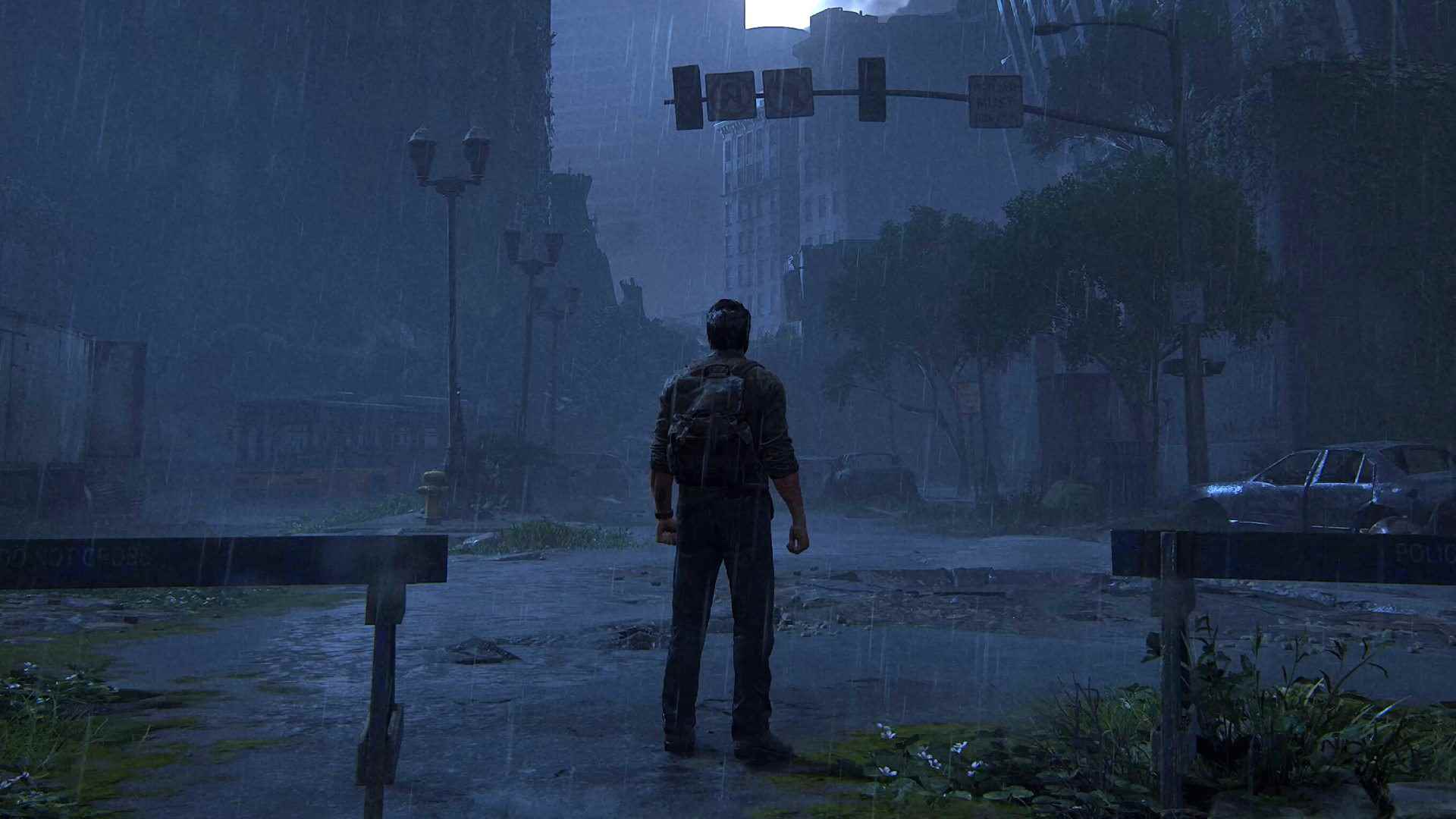 En iyi Last of Us ayarları: Yağmurlu şehir manzarasında duran Joel