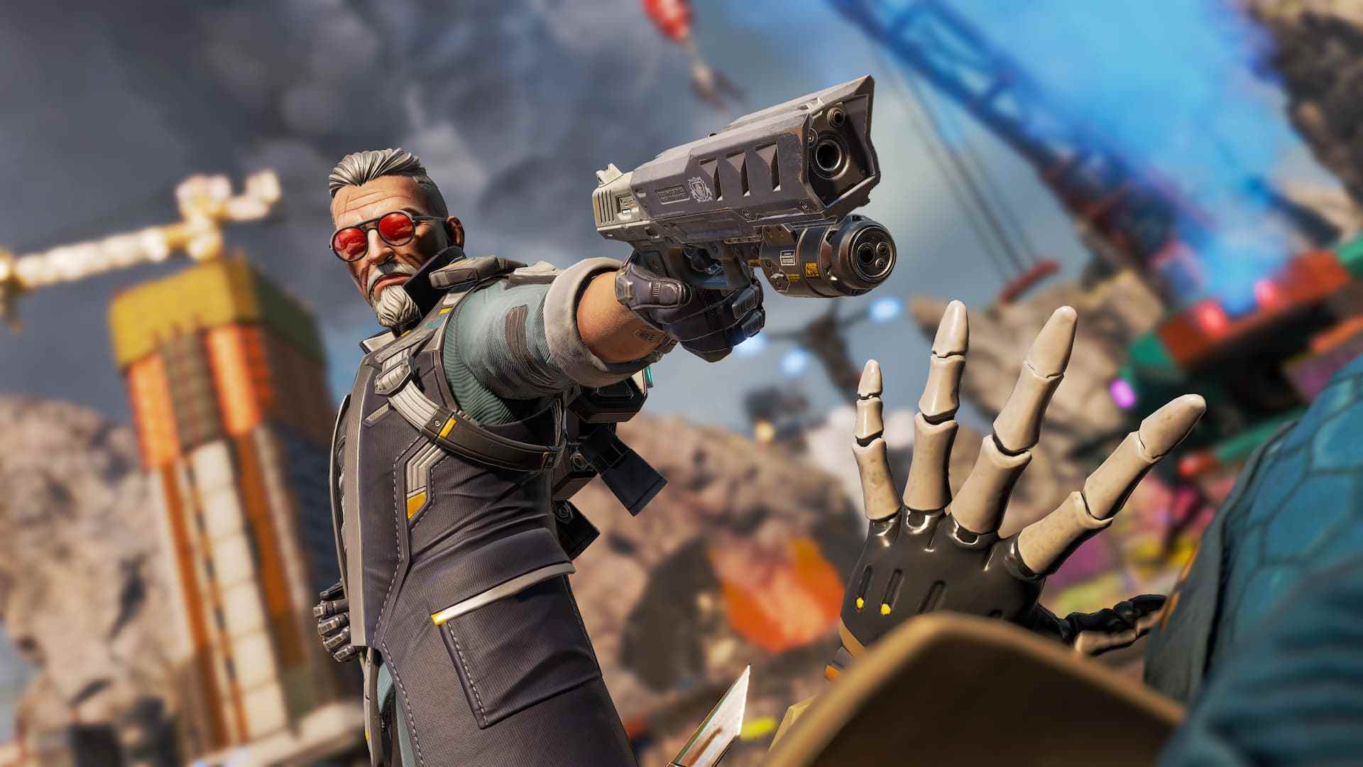 Apex Legends Ballistic -- Bu yaşlı adam tepeden tırnağa silahlı: gri saçlı ve güneş gözlüklü adam silah doğrultuyor