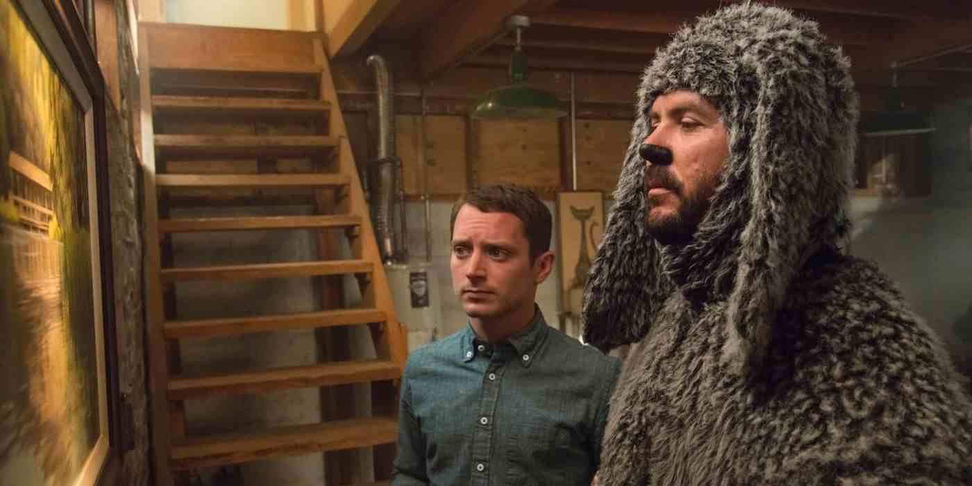 Wilfred'deki Bodrum'da Ryan Newman rolünde Elijah Wood ve Wilfred Fazio Mueller rolünde Jason Gann